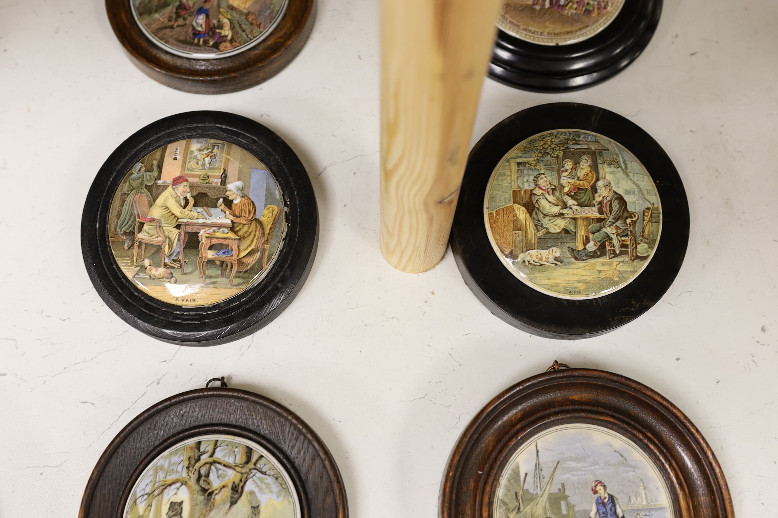 Ten 19th century framed ceramic pot lids